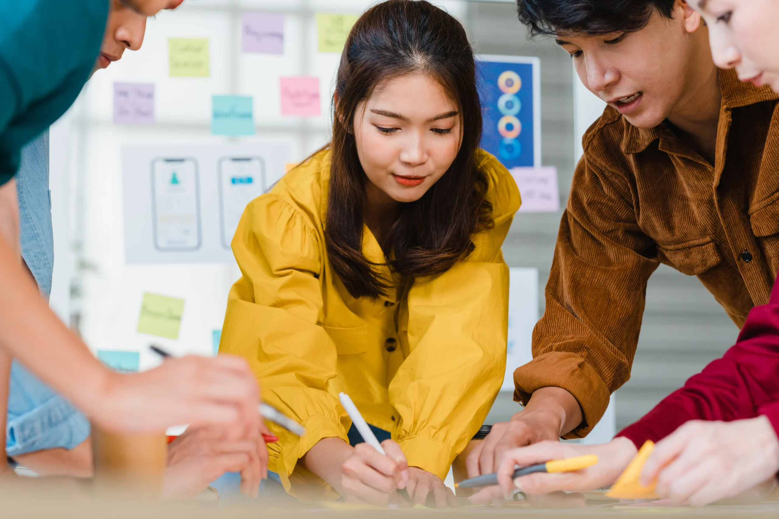 asian-businessmen-businesswomen-meeting-brainstorming-ideas-about-creative-web-design-planning-application-developing-template-layout-mobile-phone-project-working-together-small-office expertise in action