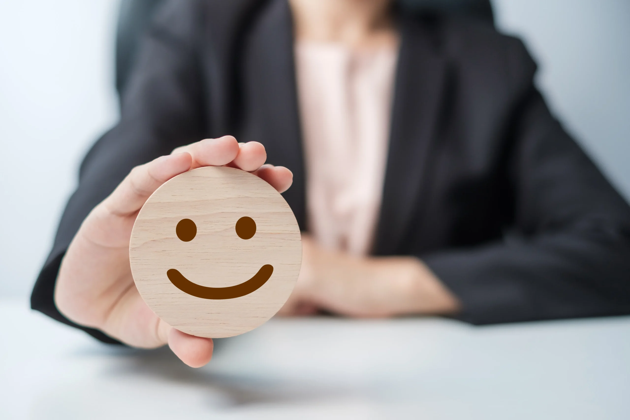 hand-holding-smile-face-block-customer-choose-emoticon-user-reviews-service-rating-ranking-customer-review-satisfaction-mood-mental-health-feedback-concept happy customer service